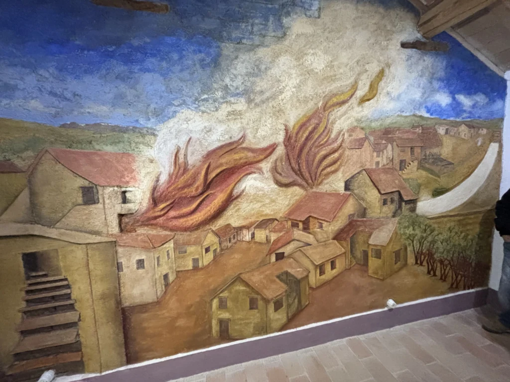 Murales che mostra l'incendio di Borgo Ficana di fine 800